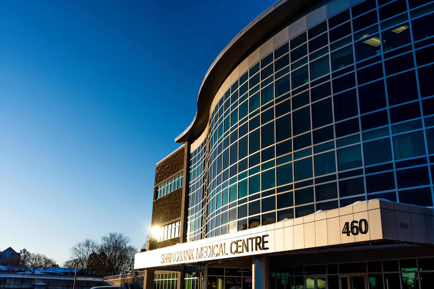 A modern medical center building entrance in daylight